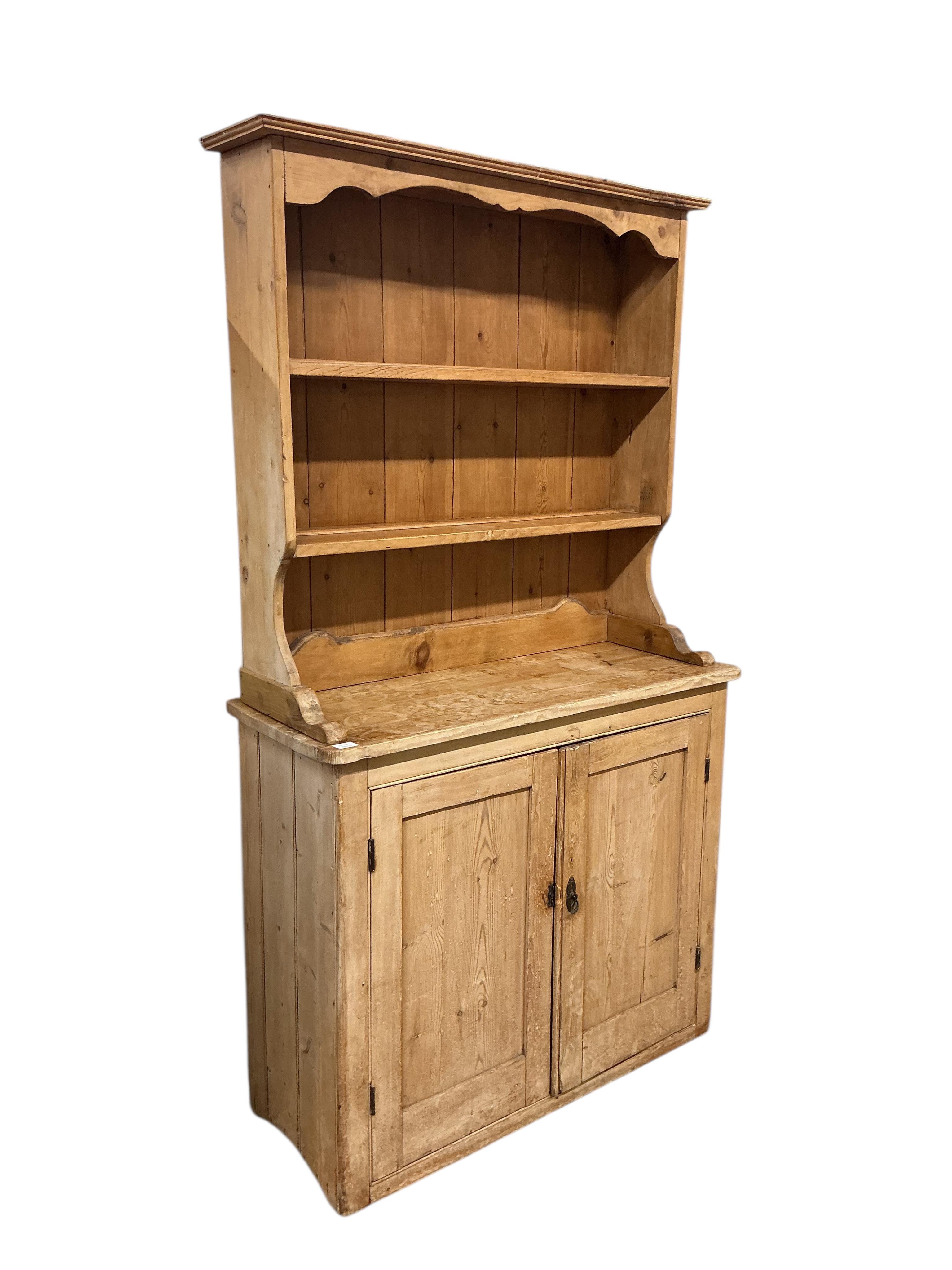A Victorian pine dresser with associated boarded rack, width 116cm, depth 45cm, height 207cm